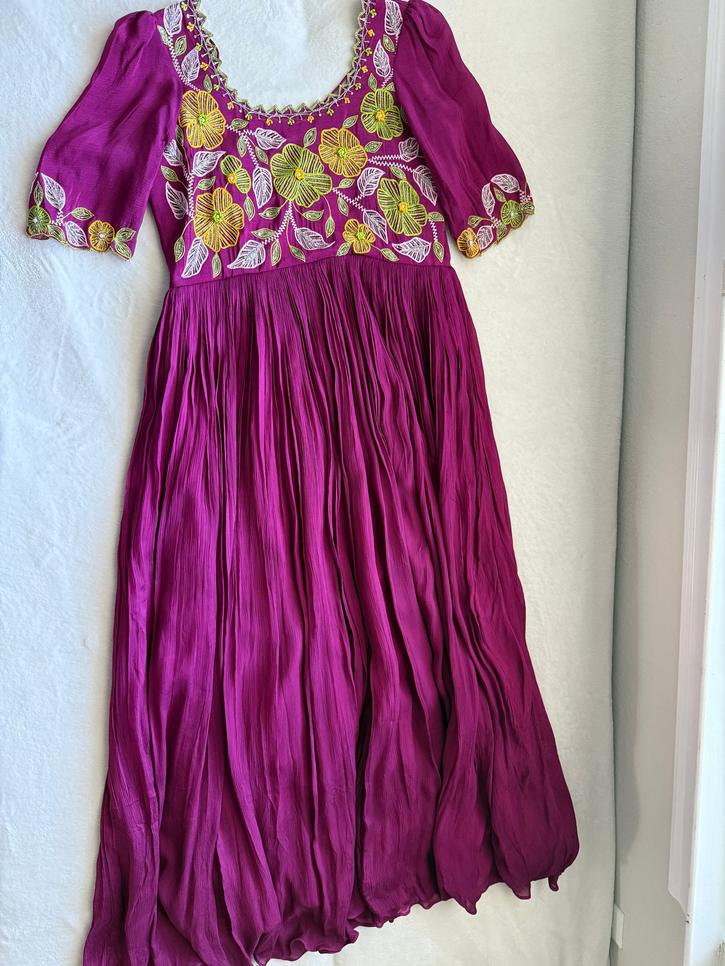 Magenta pink long anarkali designer dress with maggam work on the yolk
