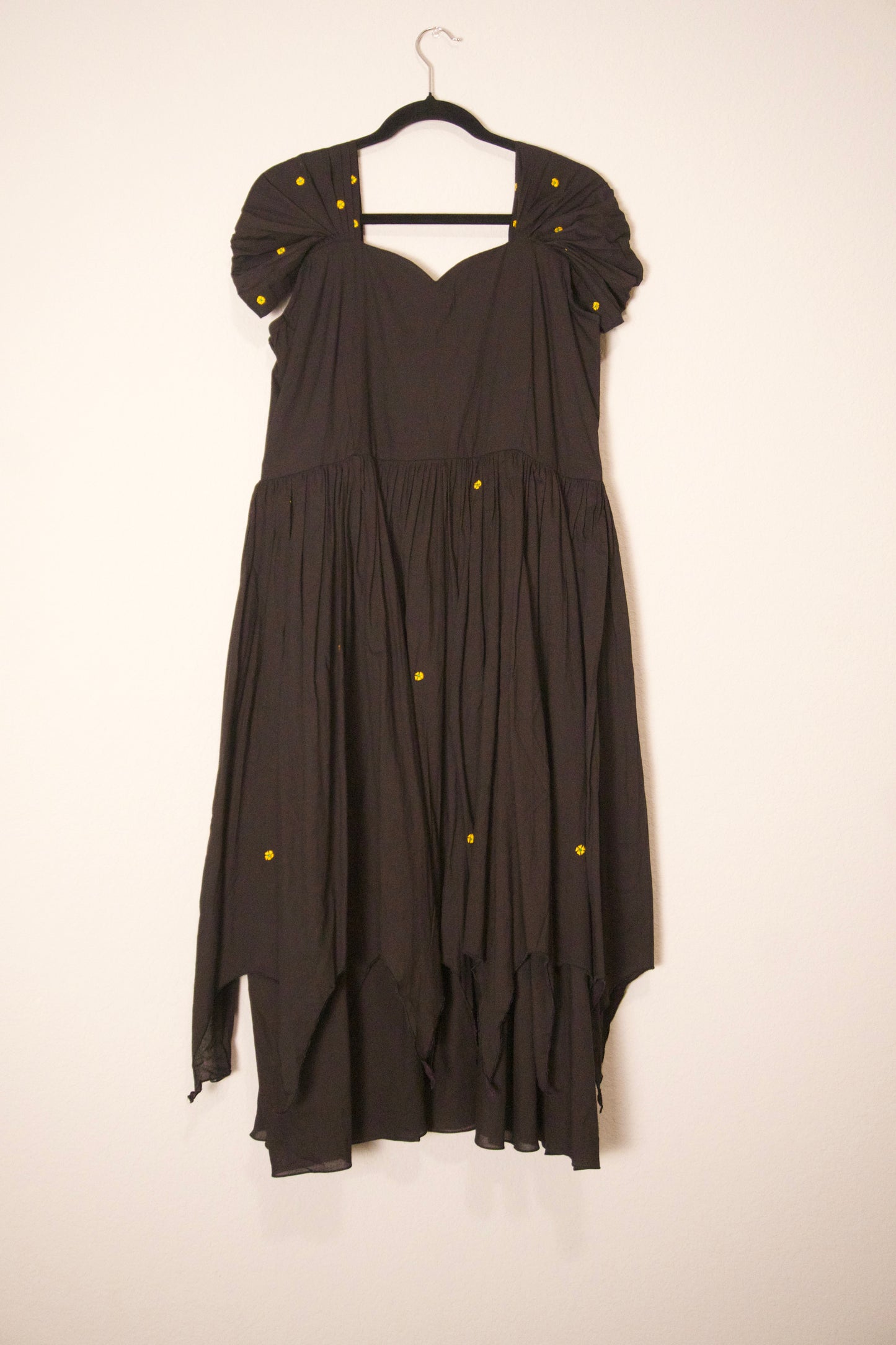 Black swan sleeve embroidered mul cotton frock with flare detailing