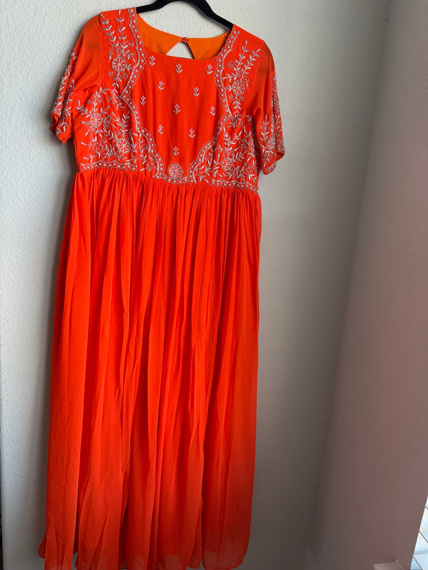 Orange georgette anarkali with silver thread maggam work on yolk