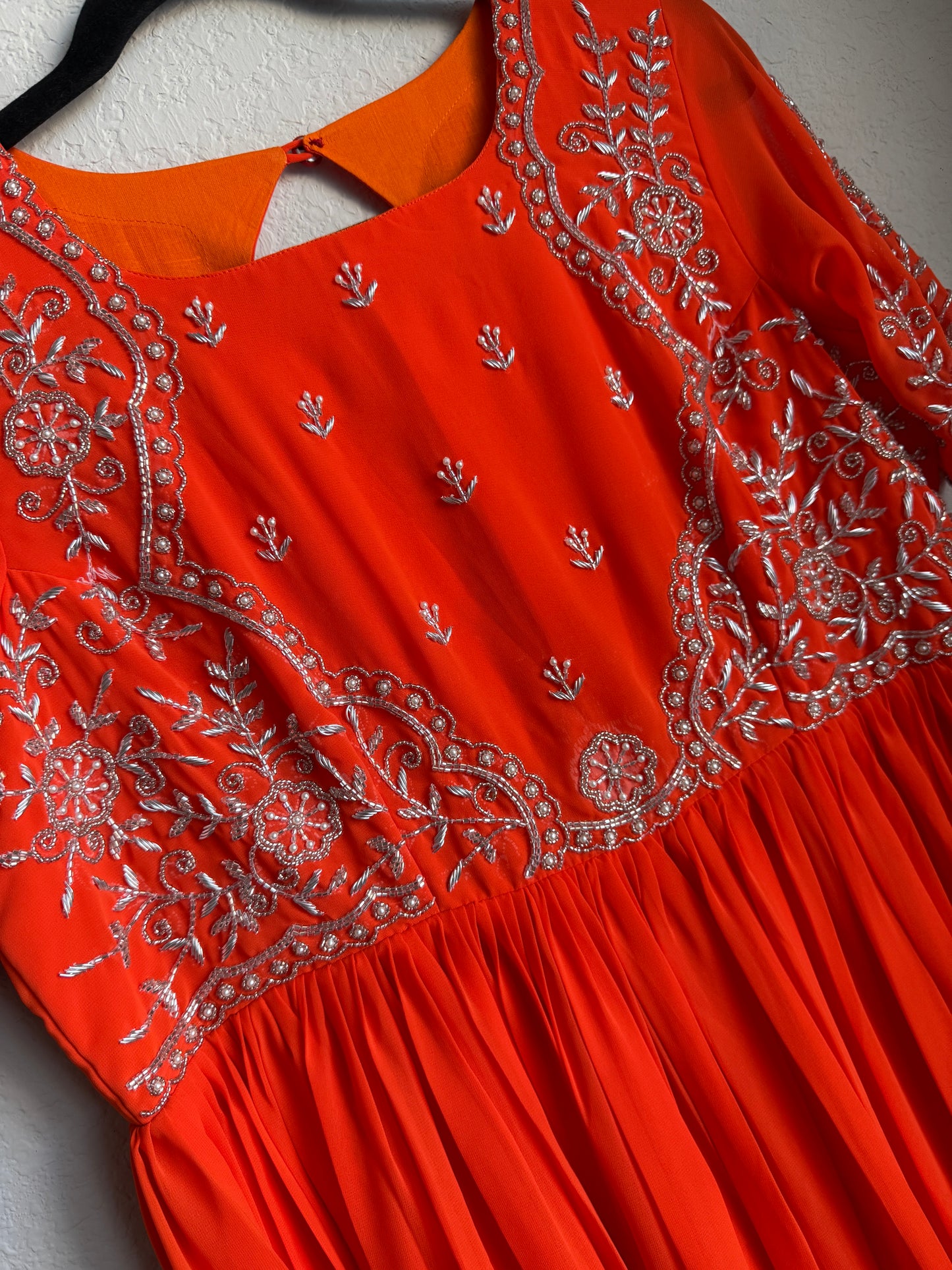 Orange georgette anarkali with silver thread maggam work on yolk