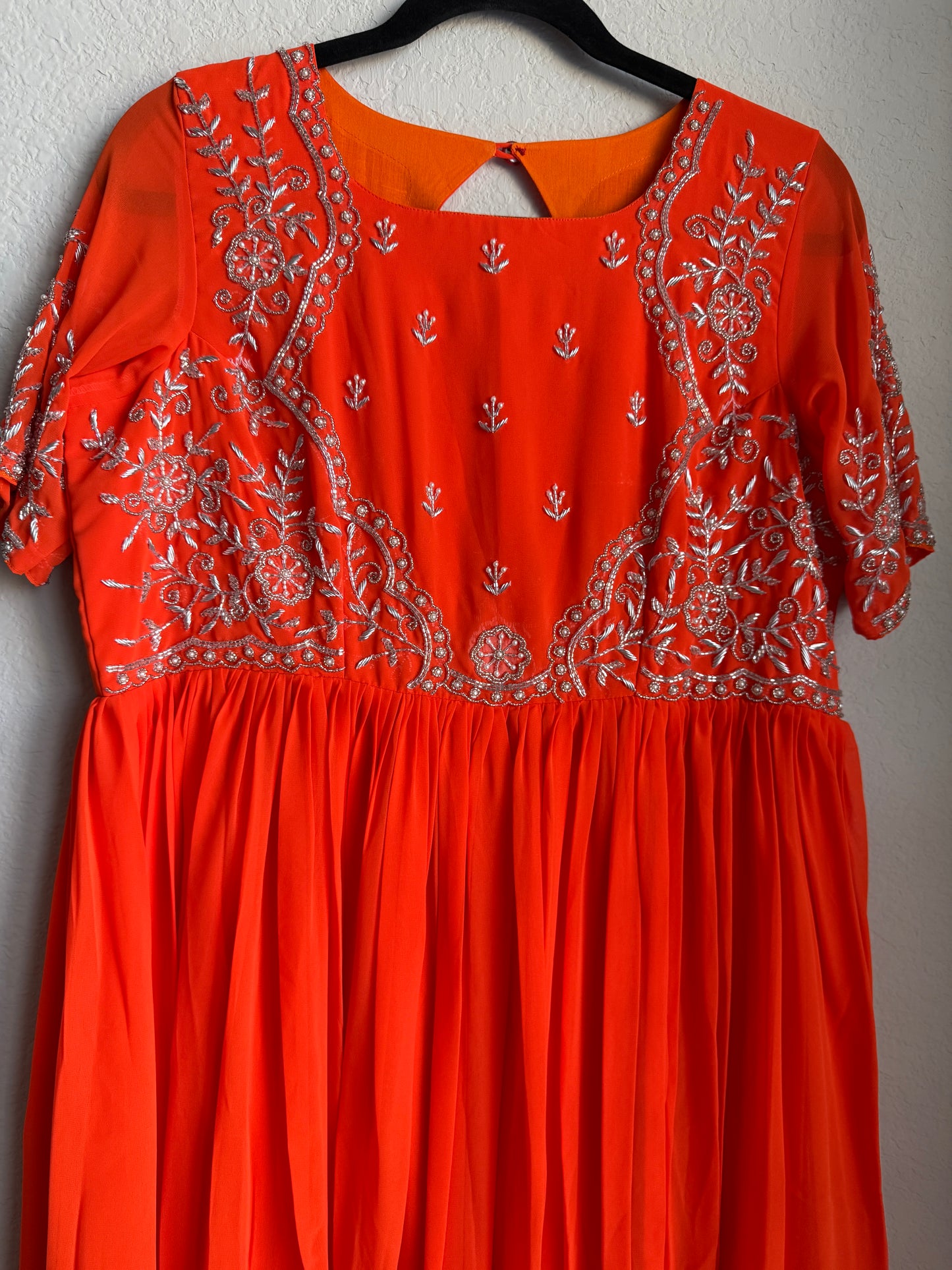 Orange georgette anarkali with silver thread maggam work on yolk