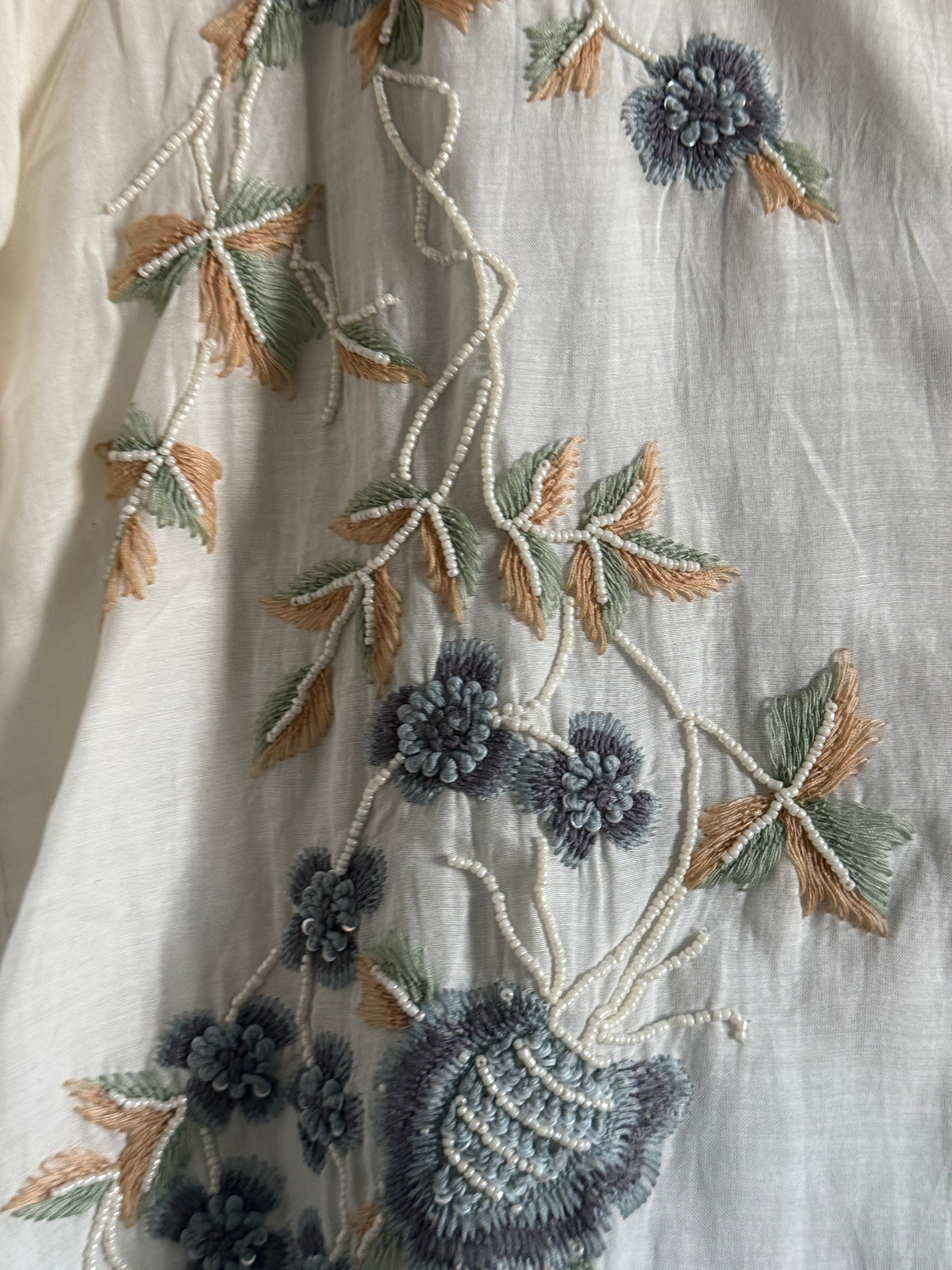 Half white and powder blue mul chanderi handwork aline suit