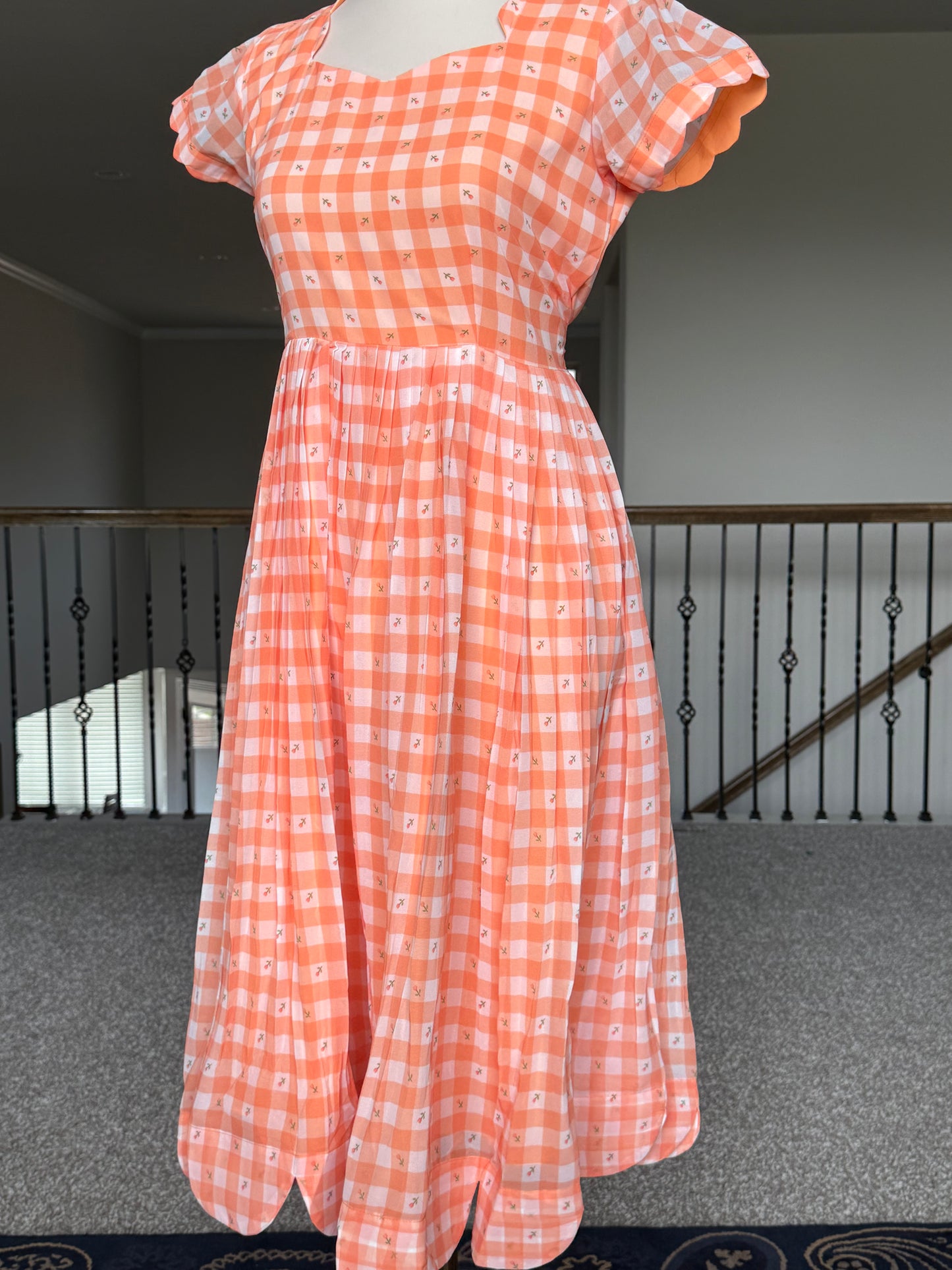 Orange Floral Checks Georgette scallop style frock with short scallop sleeve