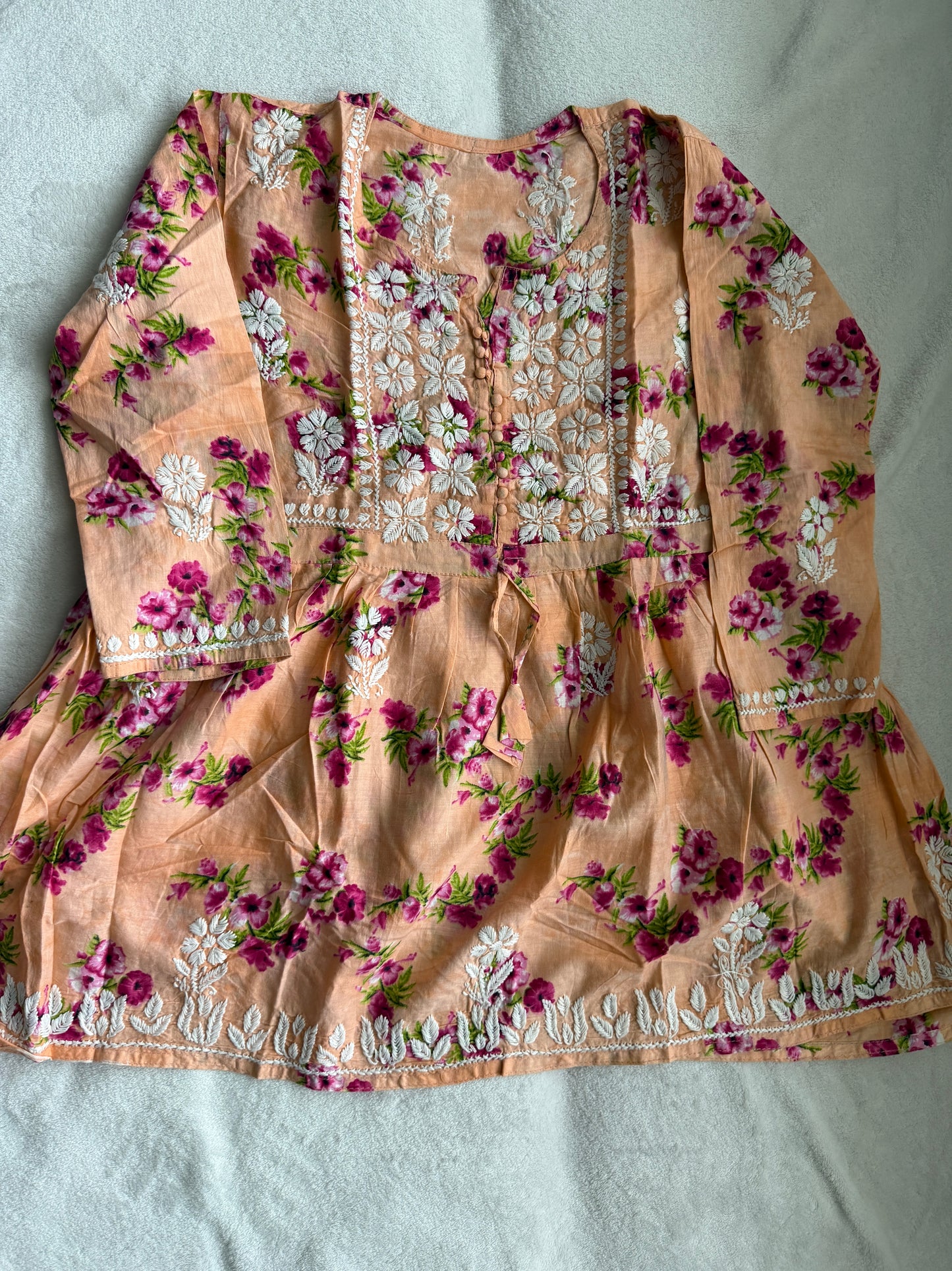 Peach chikankari short kurti - peplum style