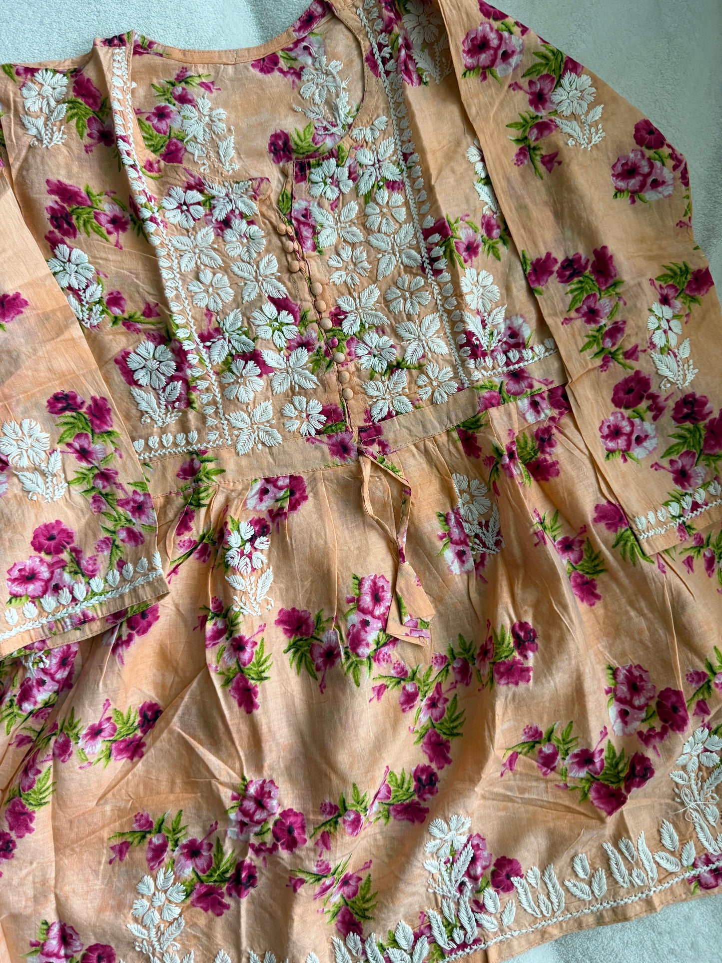 Peach chikankari short kurti - peplum style