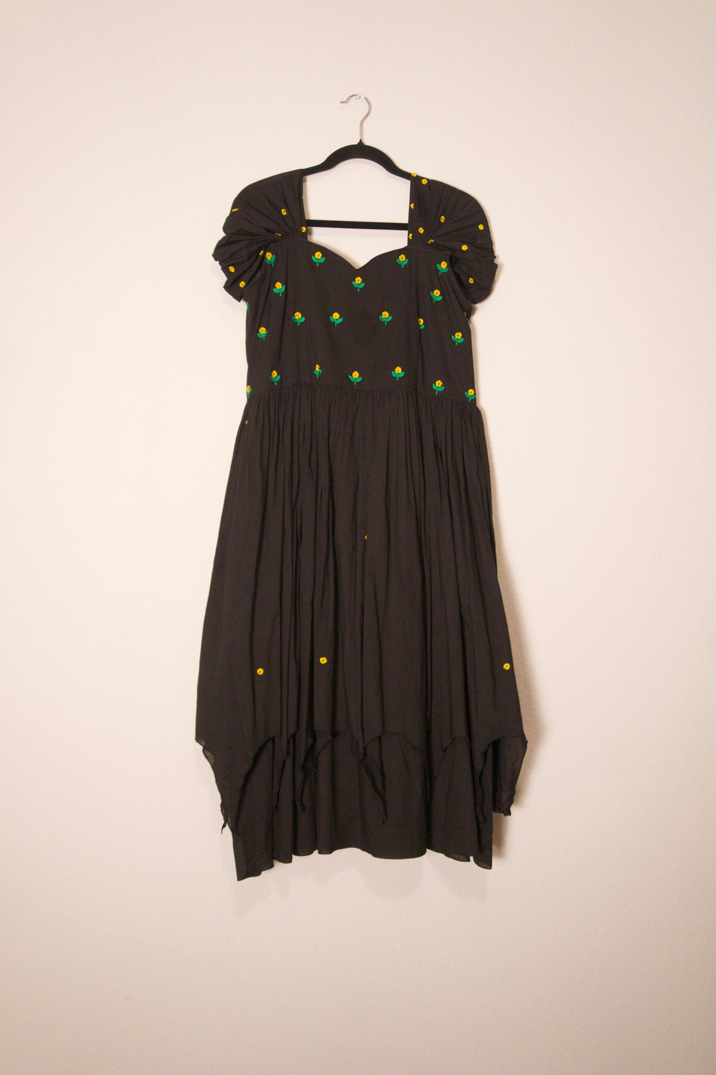 Black swan sleeve embroidered mul cotton frock with flare detailing