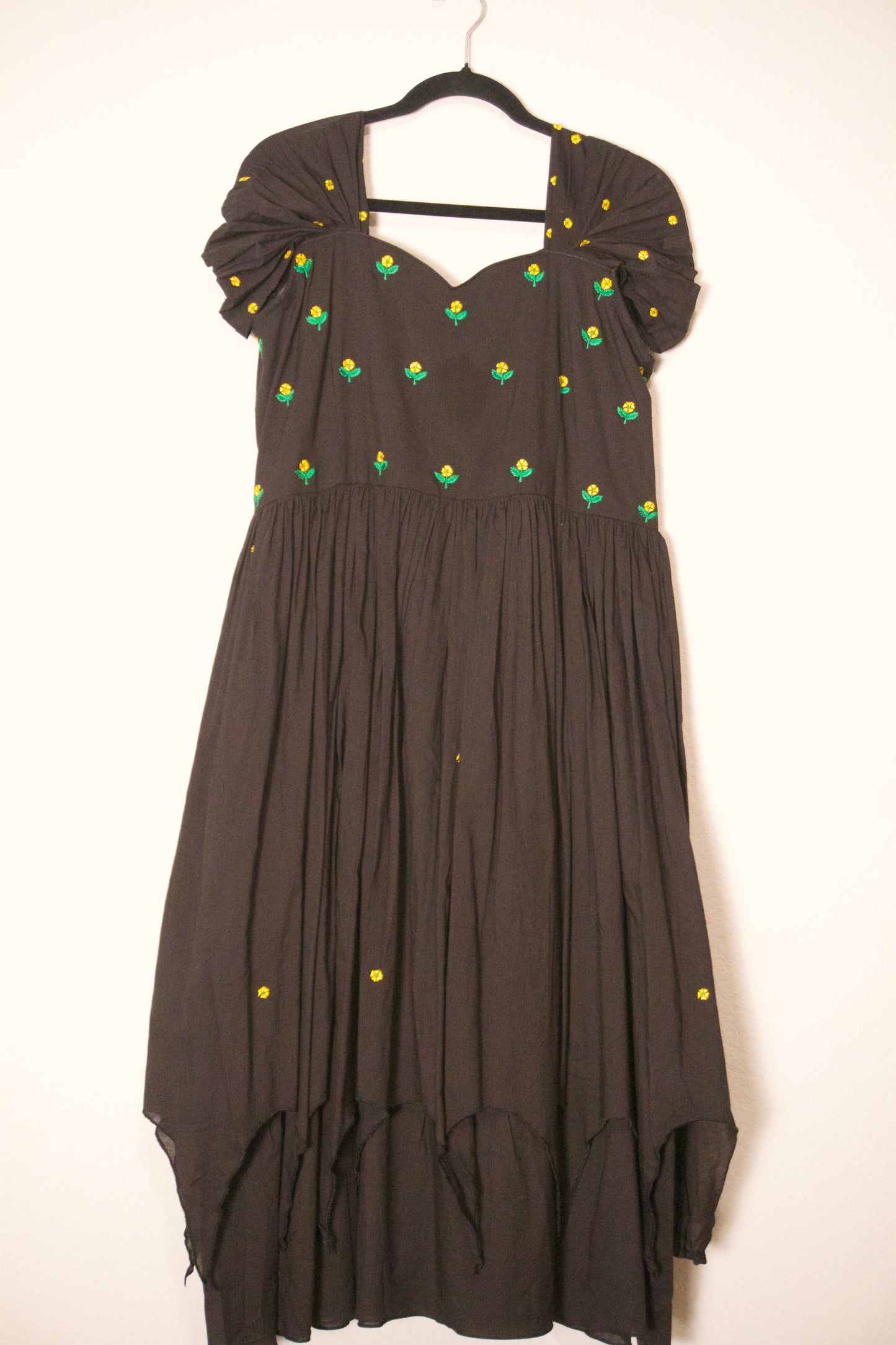 Black swan sleeve embroidered mul cotton frock with flare detailing