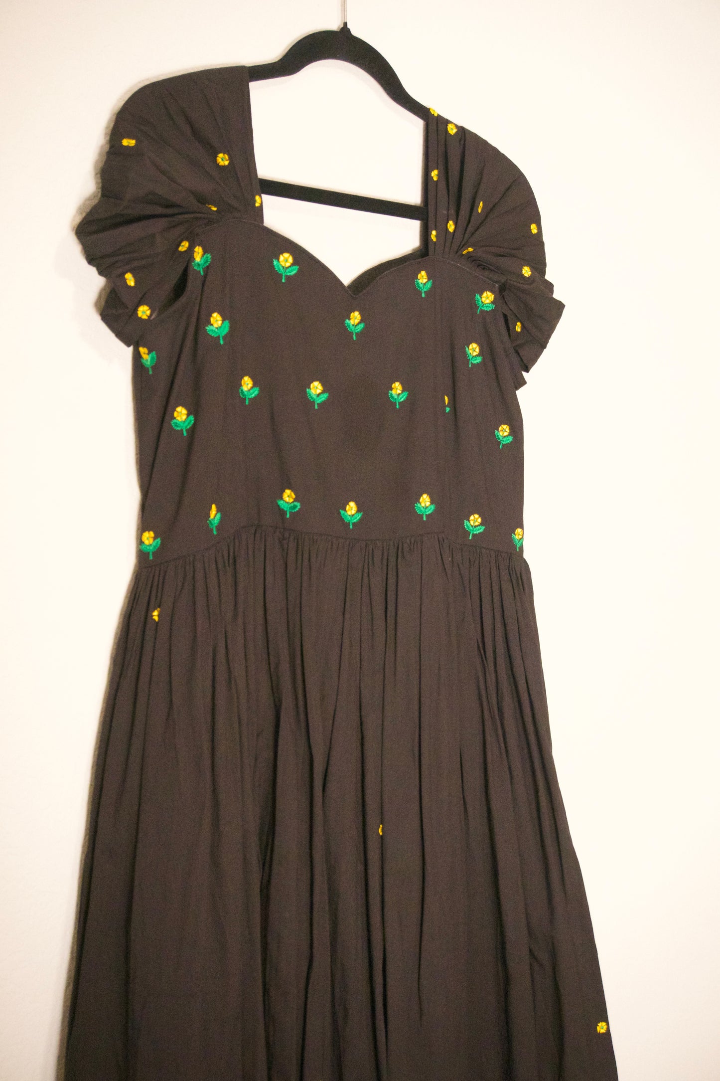 Black swan sleeve embroidered mul cotton frock with flare detailing