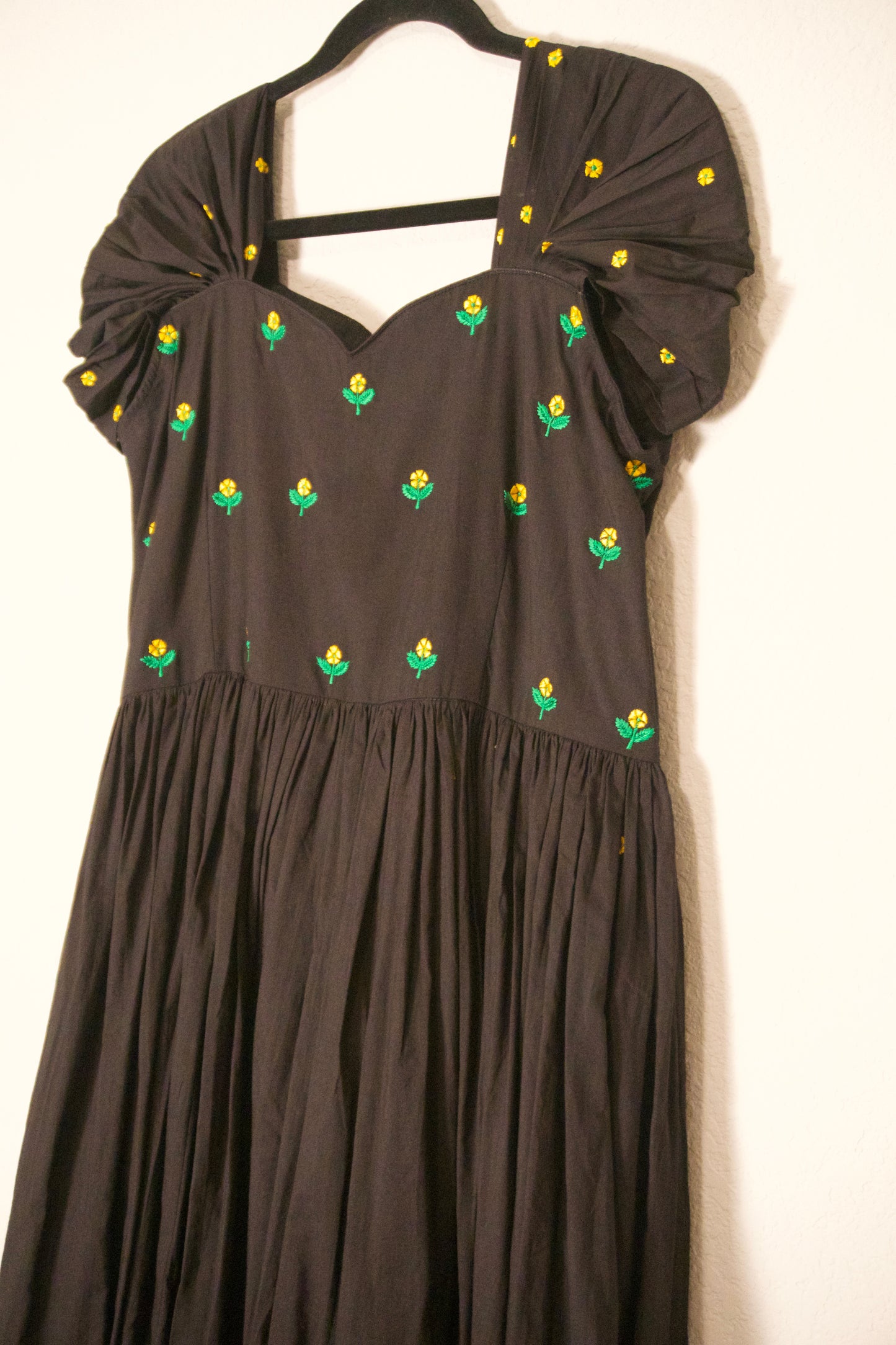 Black swan sleeve embroidered mul cotton frock with flare detailing