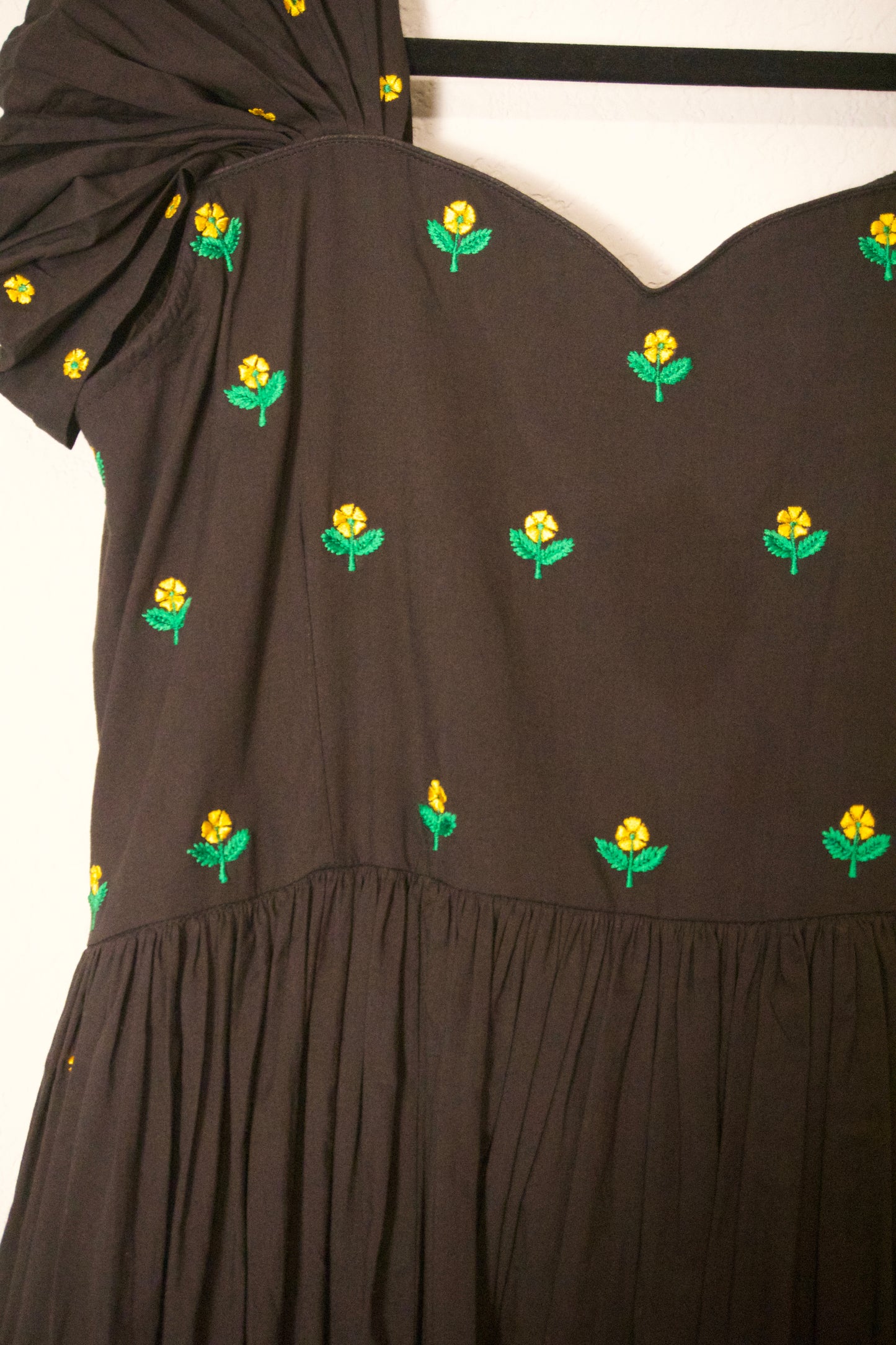Black swan sleeve embroidered mul cotton frock with flare detailing