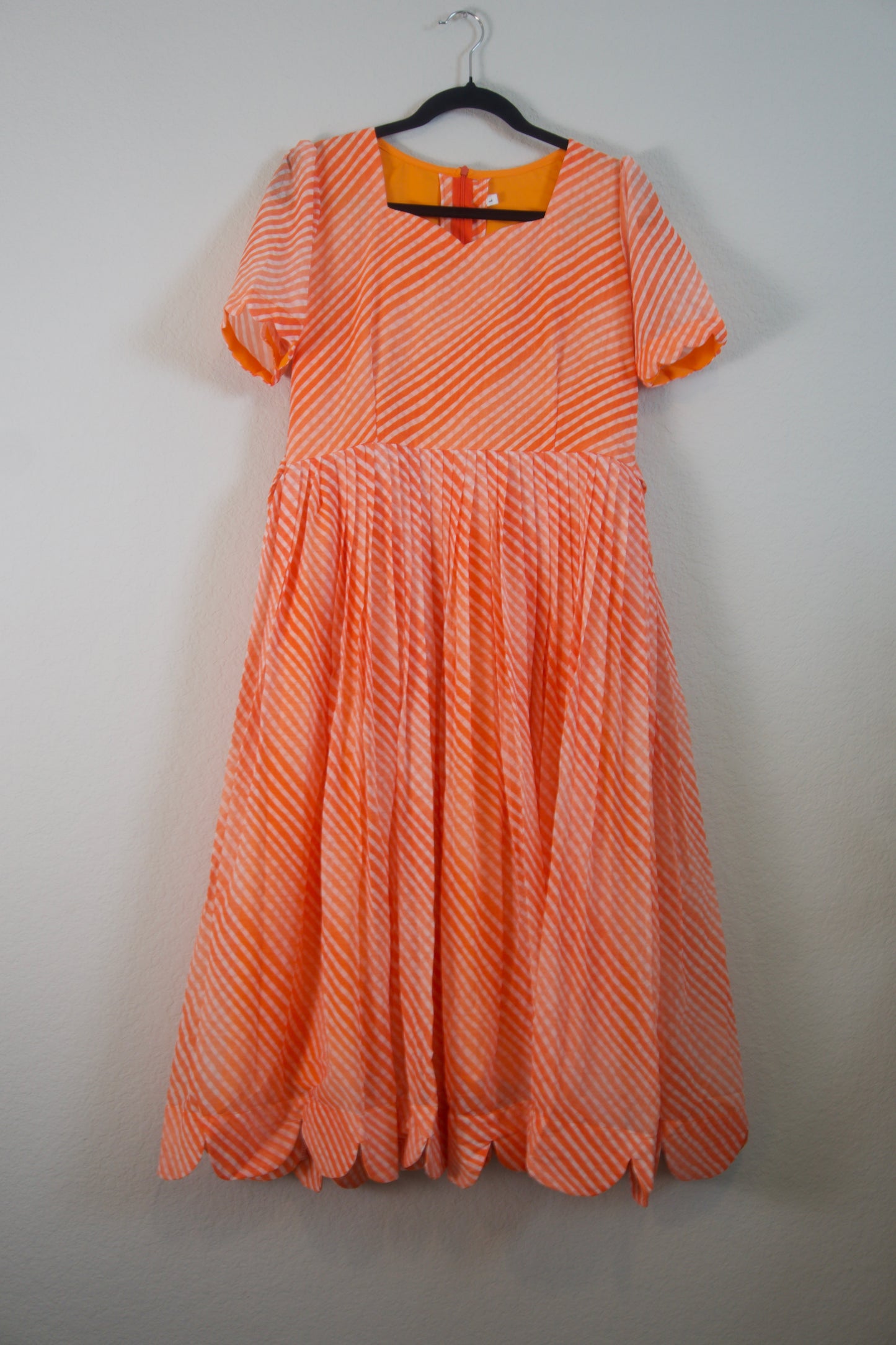 Orange Lehariya Georgette Scallop flare frock with elbow scallop sleeves